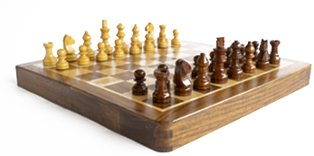 wooden chess board and pieces